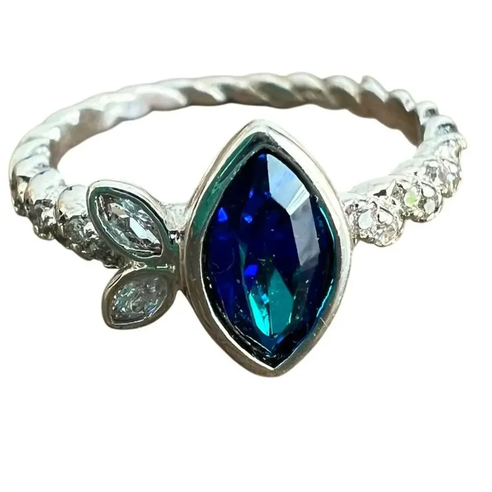 Sapphire blue colored crystal studded elegant ring on silver tone band size 6.25
